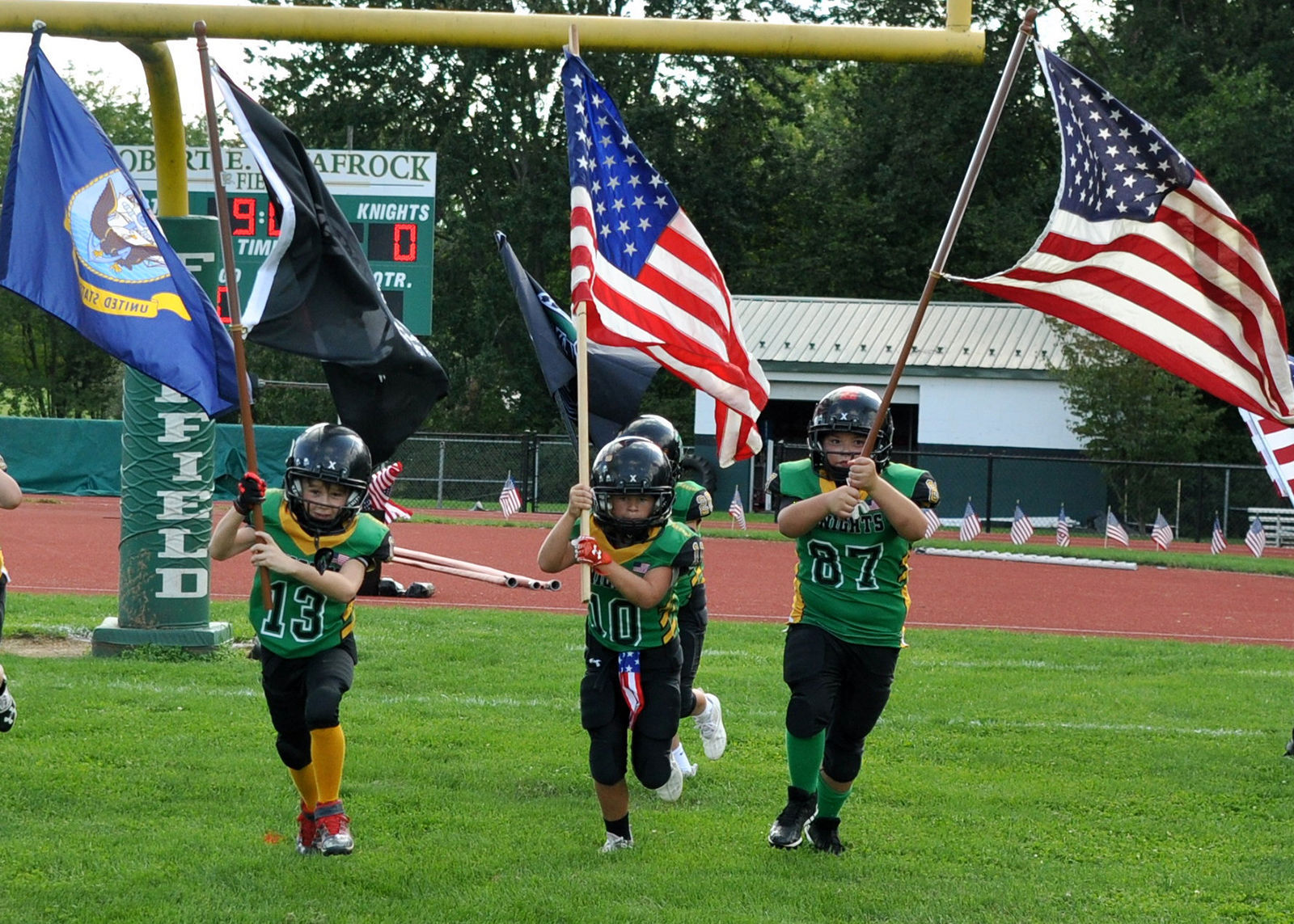 Youth present flags